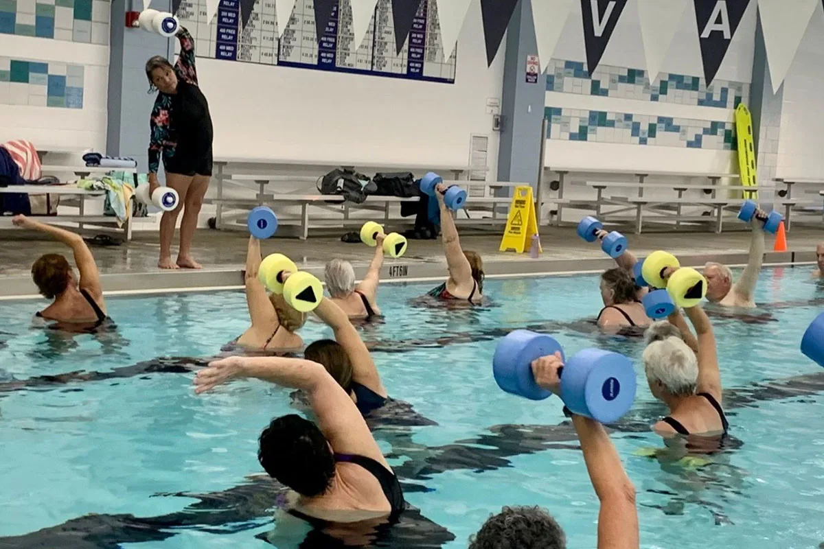 YMCA memberships enjoy water aerobics exercises during a water fitness class at the YMCA pool